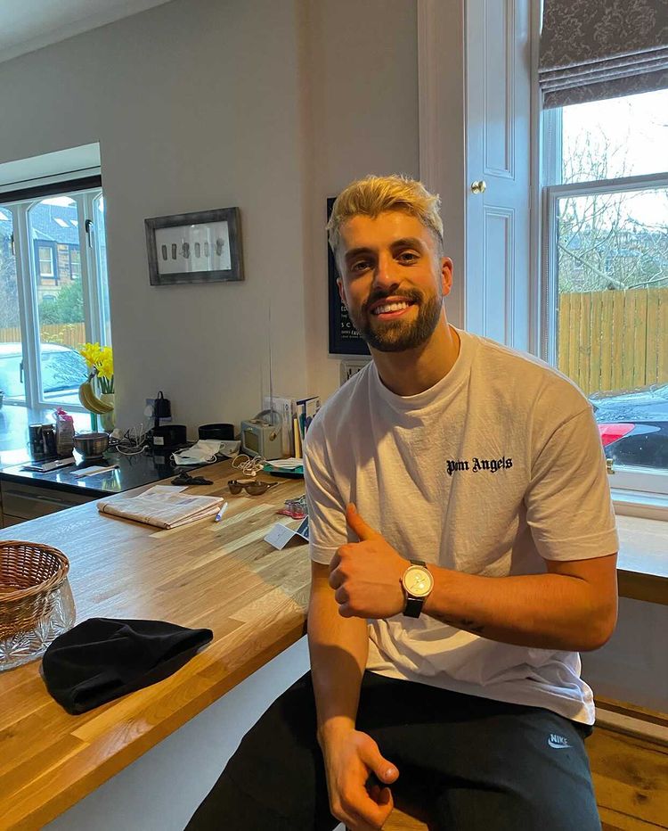 JJ Monaghan on the wrist of Glasgow Warriors and International Scotland rugby star Adam Hastings