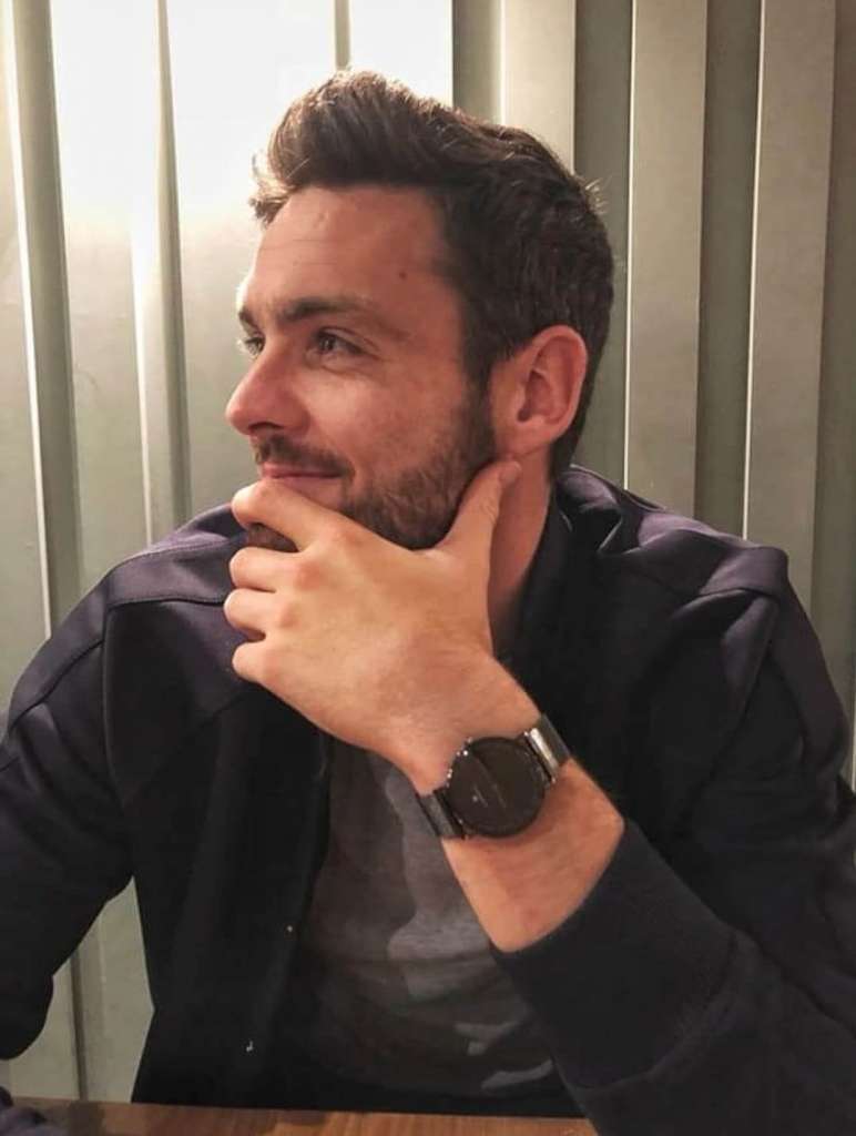 JJ Monaghan on the wrist of Celtic and Scotland #1 Craig Gordon